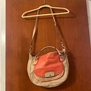 Multicolored medium sized Coach bag in good condition.